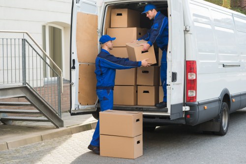 Professional movers handling furniture for pick-up