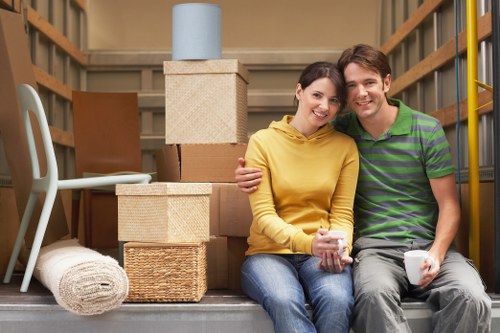 Professional movers handling household items with care