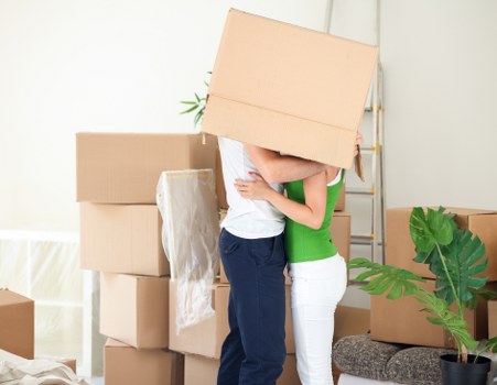 Furniture being carefully loaded into a van for relocation